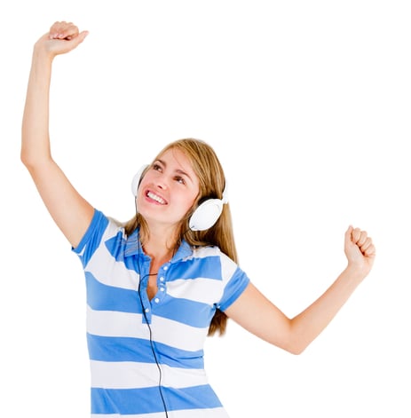 Woman loving music wearing headphones - isolated over white